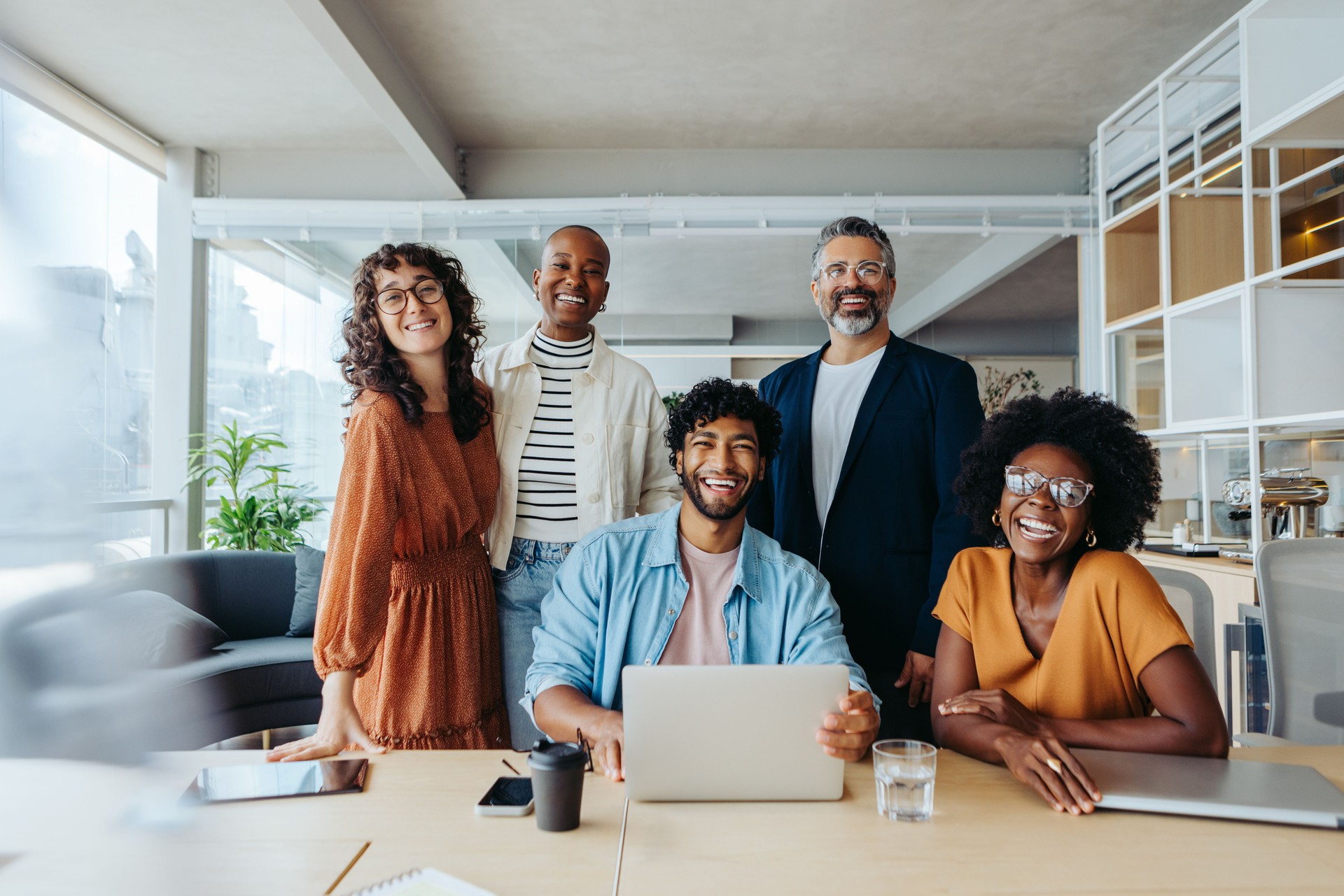 Successful team of business people smiling at the camera in a startup office